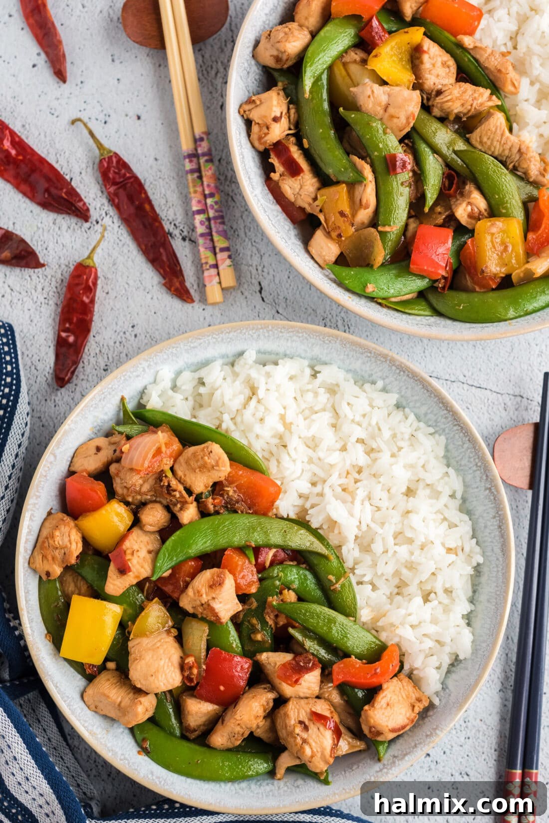 A perfectly portioned serving of Kung Pao Chicken, beautifully presented on a plate.