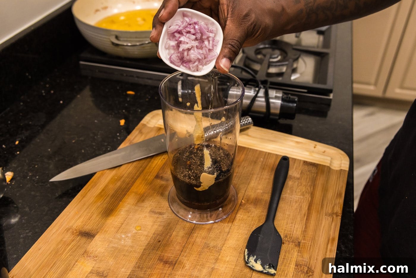 Sweet-Tart Balsamic Dressing 5 Adding shallots and other ingredients to balsamic dressing in an immersion blender container