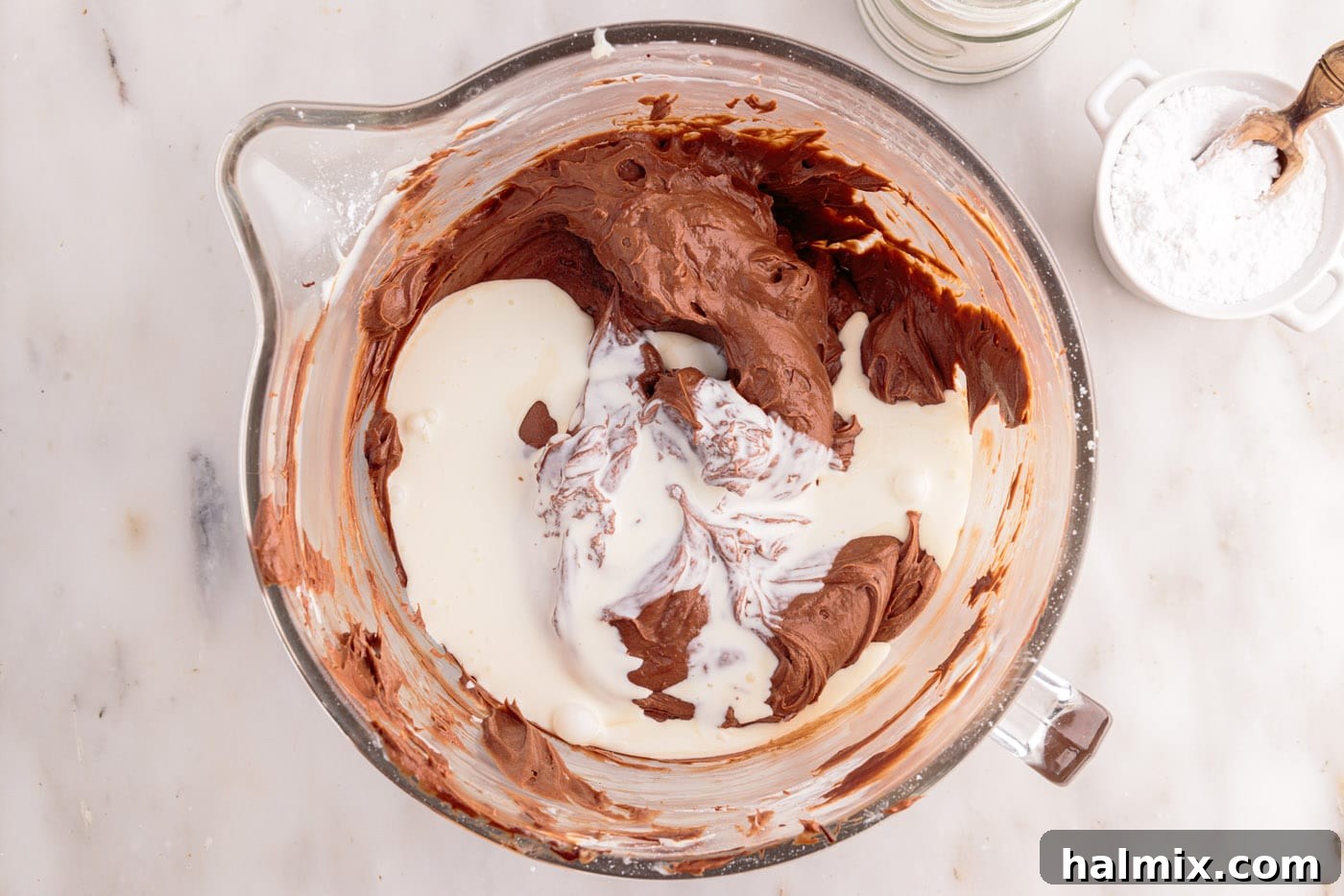 mixing heavy whipping cream to chocolate cheesecake mixture