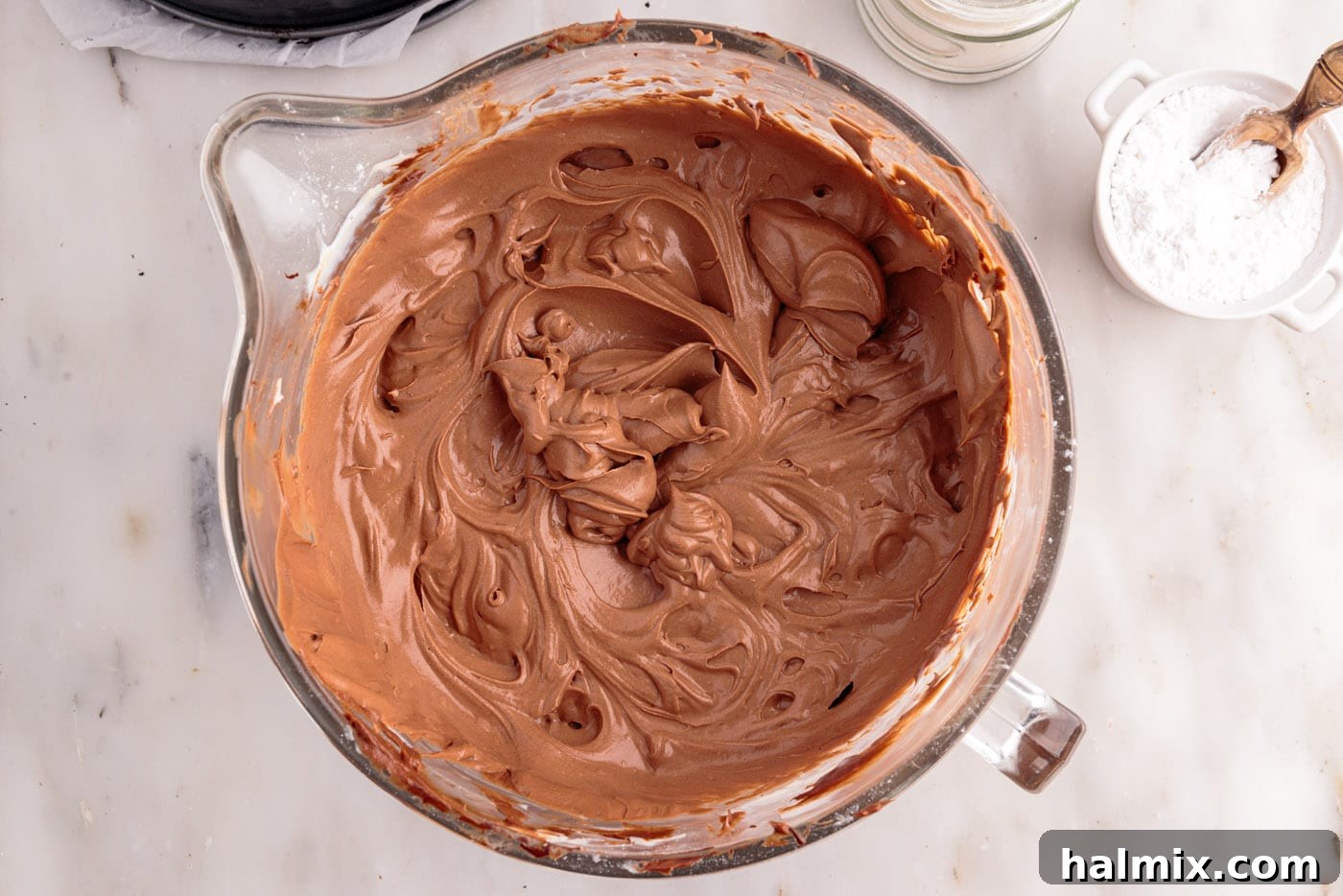 chocolate cheesecake mixture in a mixing bowl