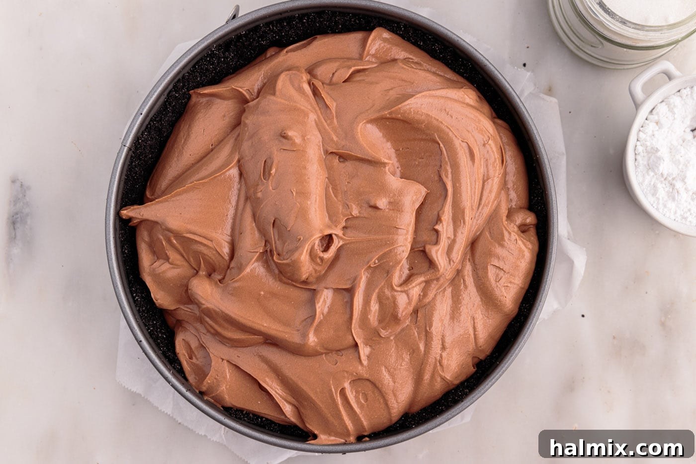 chocolate cheesecake mixture in a springform pan