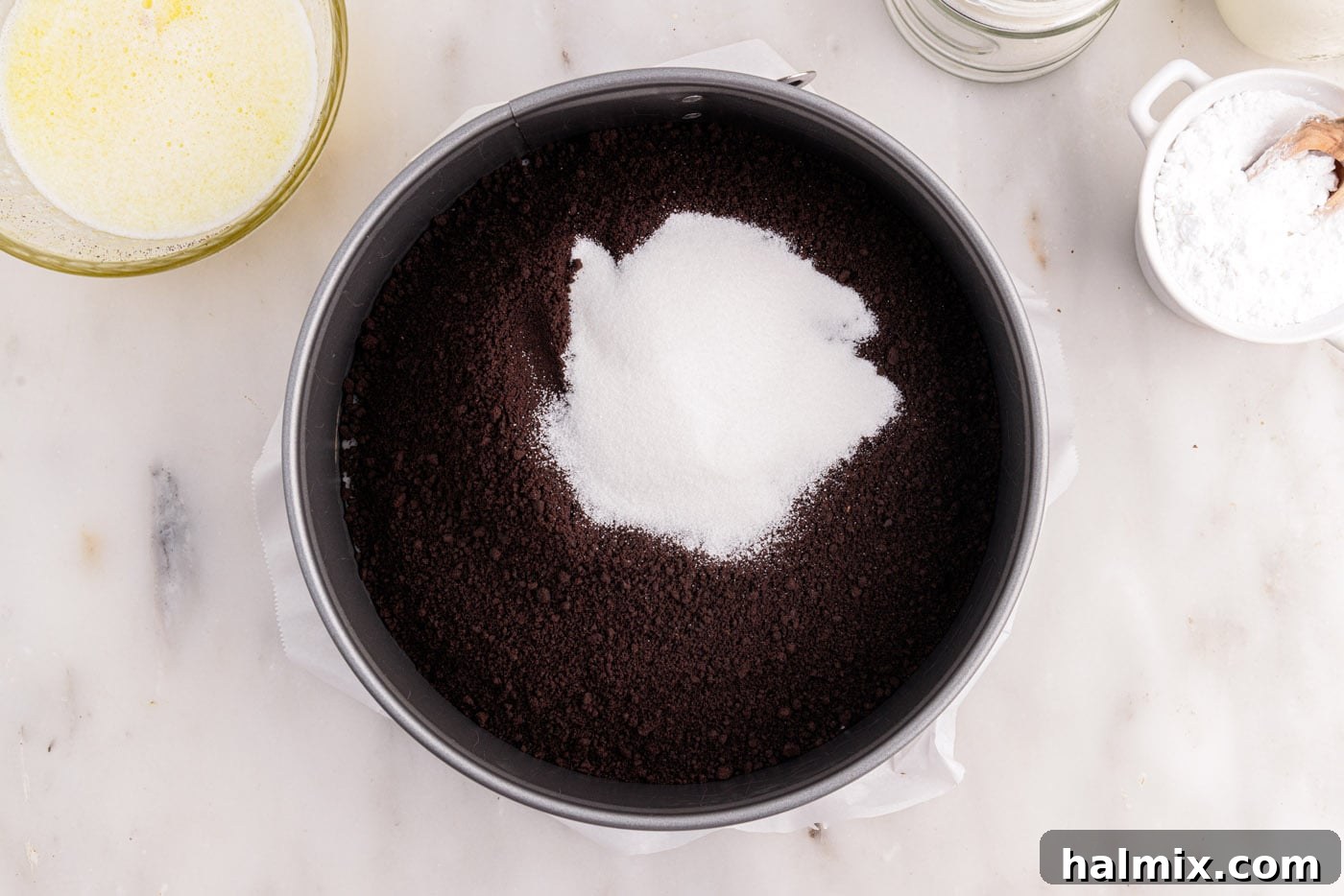 chocolate graham cracker crumbs and sugar in a springform pan