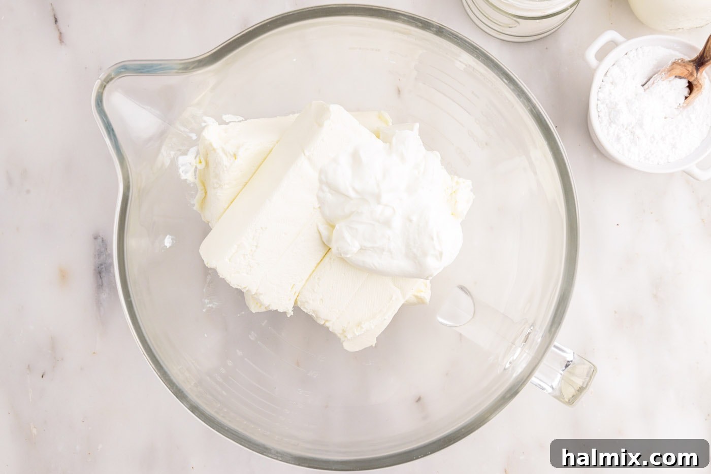 cream cheese and sour cream in a mixing bowl