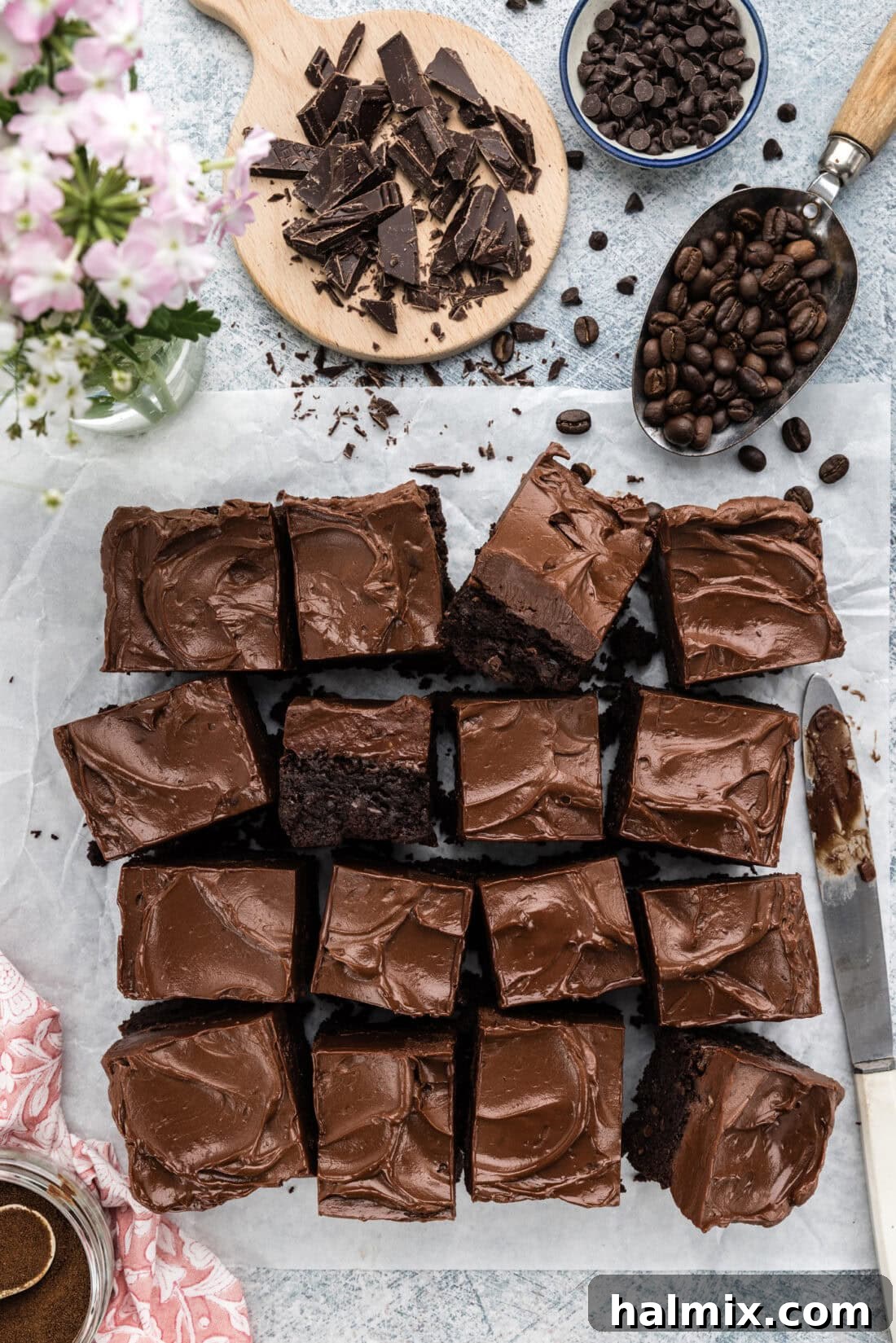 Fudge Frosted Espresso Brownies cut into perfect squares on parchment paper, ready to be served