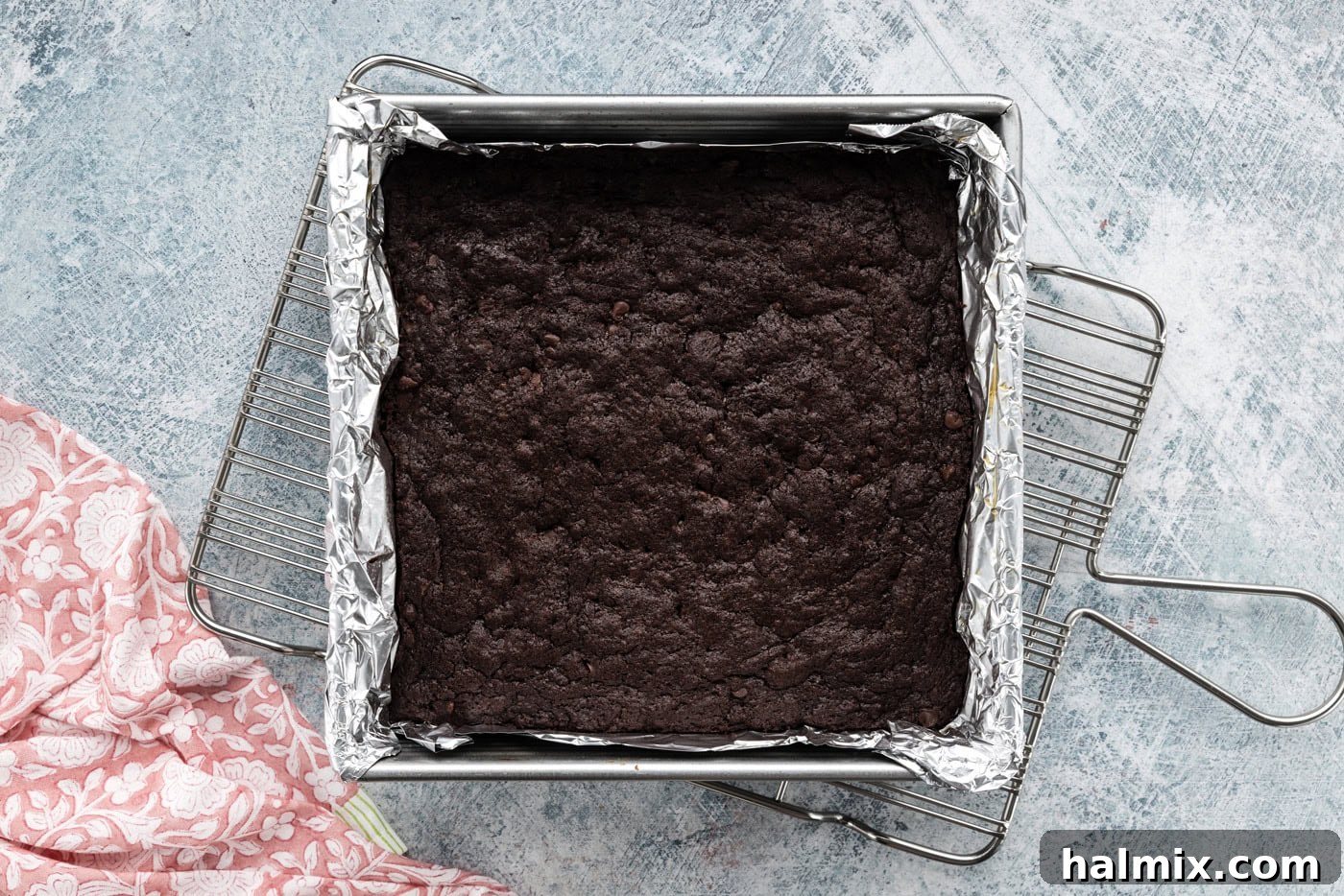 overhead shot of freshly baked, rich espresso brownies cooling in a baking pan