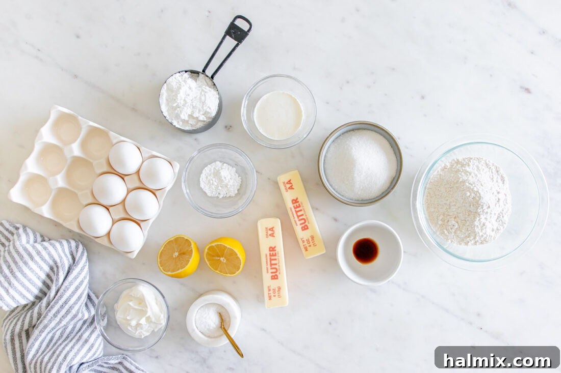 A flat lay photograph showcasing all the fresh ingredients needed to bake a delicious Lemon Pound Cake.