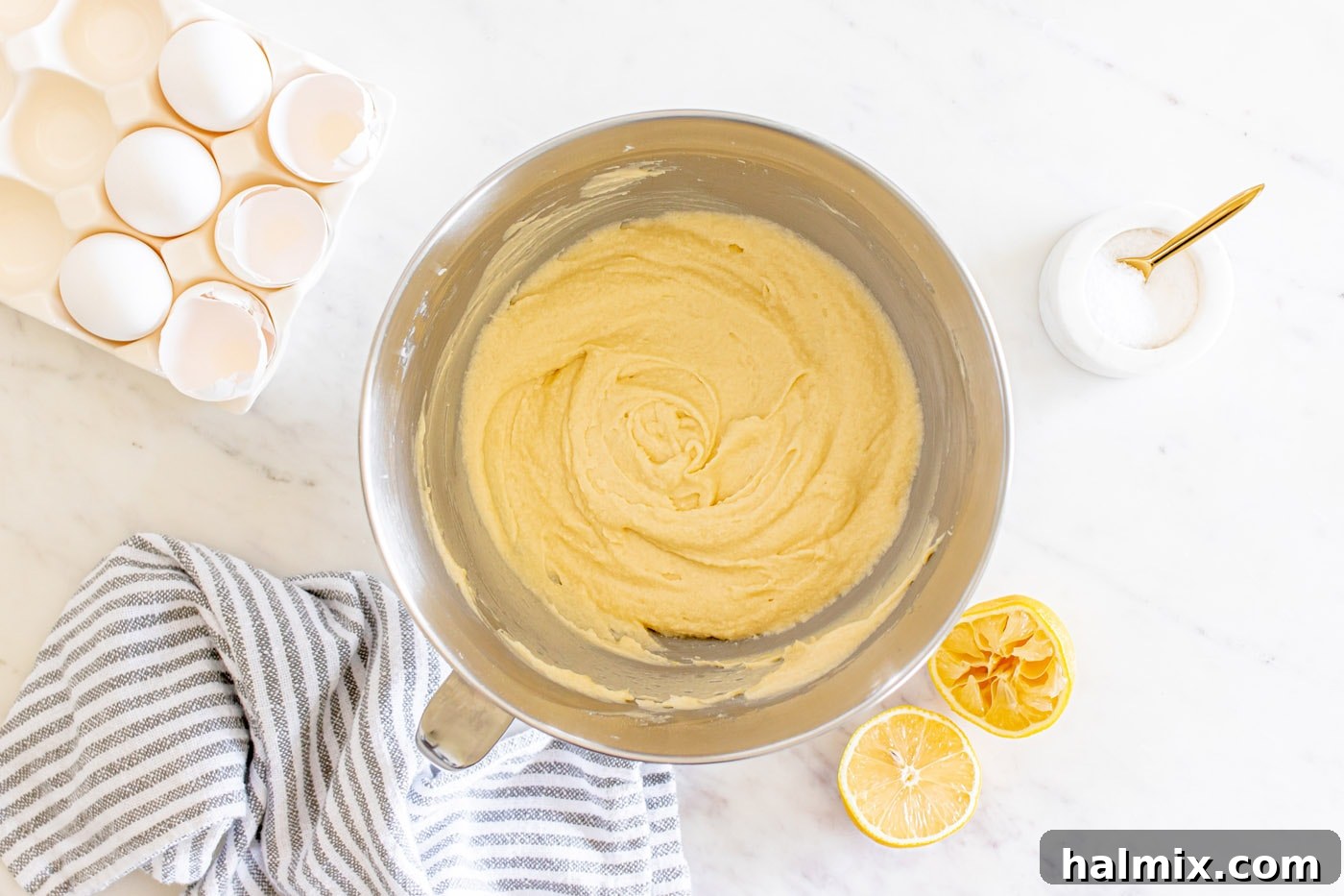 Smooth lemon pound cake batter in a mixing bowl, ready for baking.