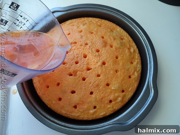 A close-up shot of the creamy, dreamy orange buttercream frosting, showcasing its smooth texture and vibrant color.