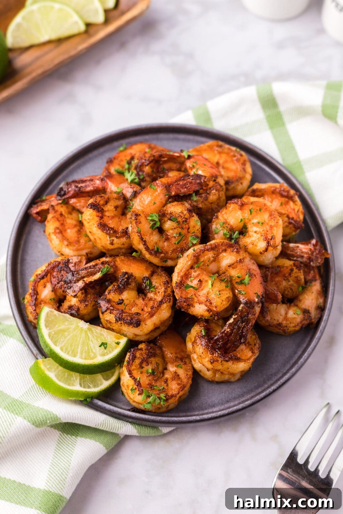 A beautifully plated dish of Spicy Shrimp, garnished and ready to serve.