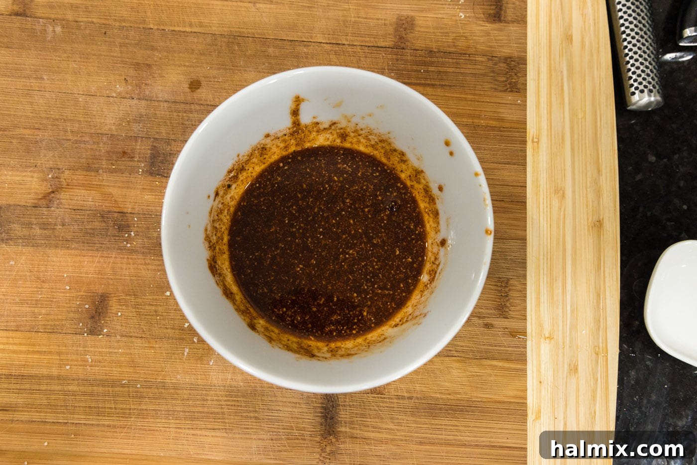 Spicy shrimp spice mixture in a bowl, showcasing the consistency of the paste.