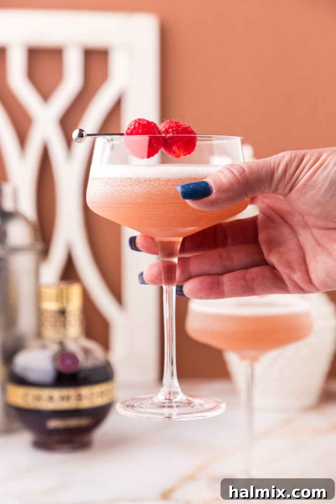 Hand holding up a French Martini