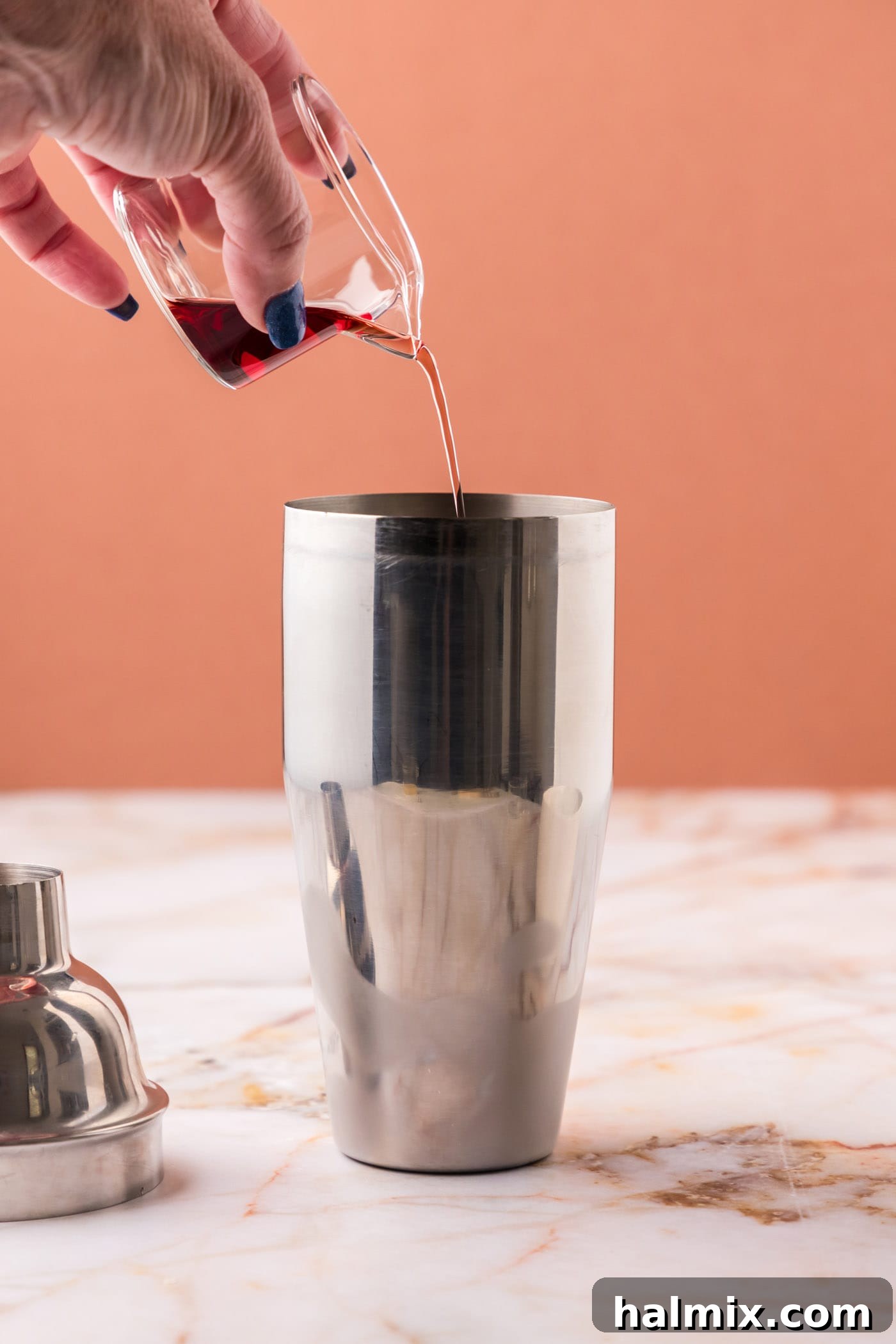 pouring chambord into cocktail shaker
