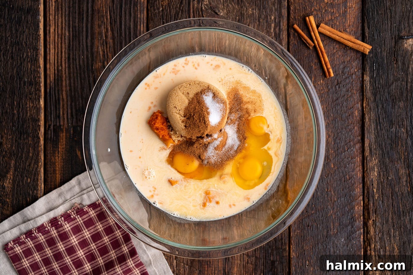 eggs, sugar, and pumpkin puree in a bowl