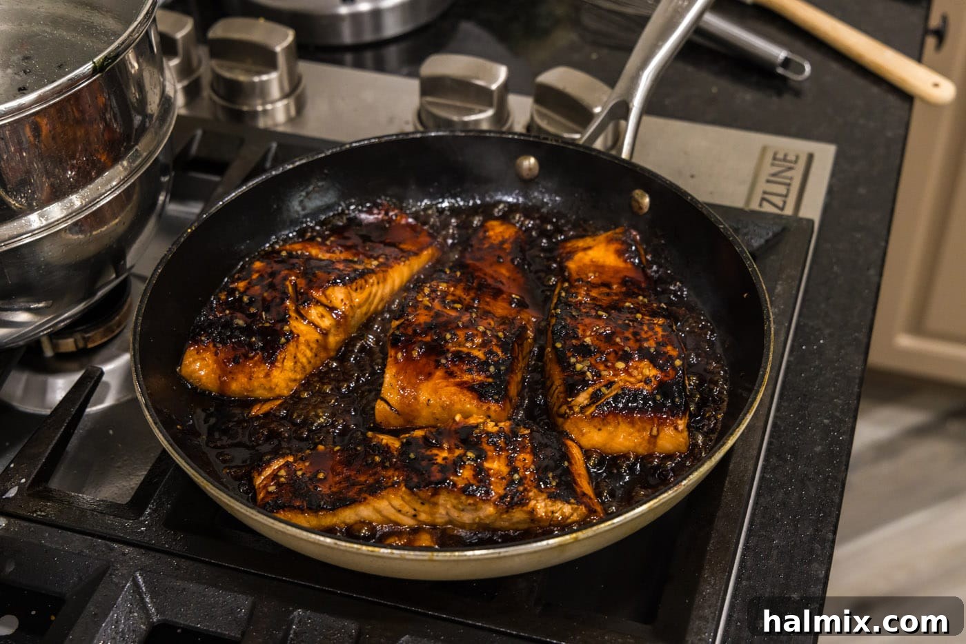 How to make honey glazed salmon in a skillet, showing the finished dish.