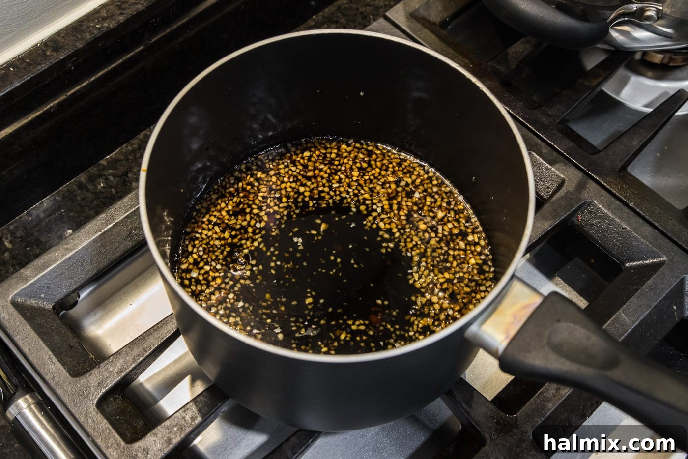 All honey salmon glaze ingredients mixed in a saucepan.