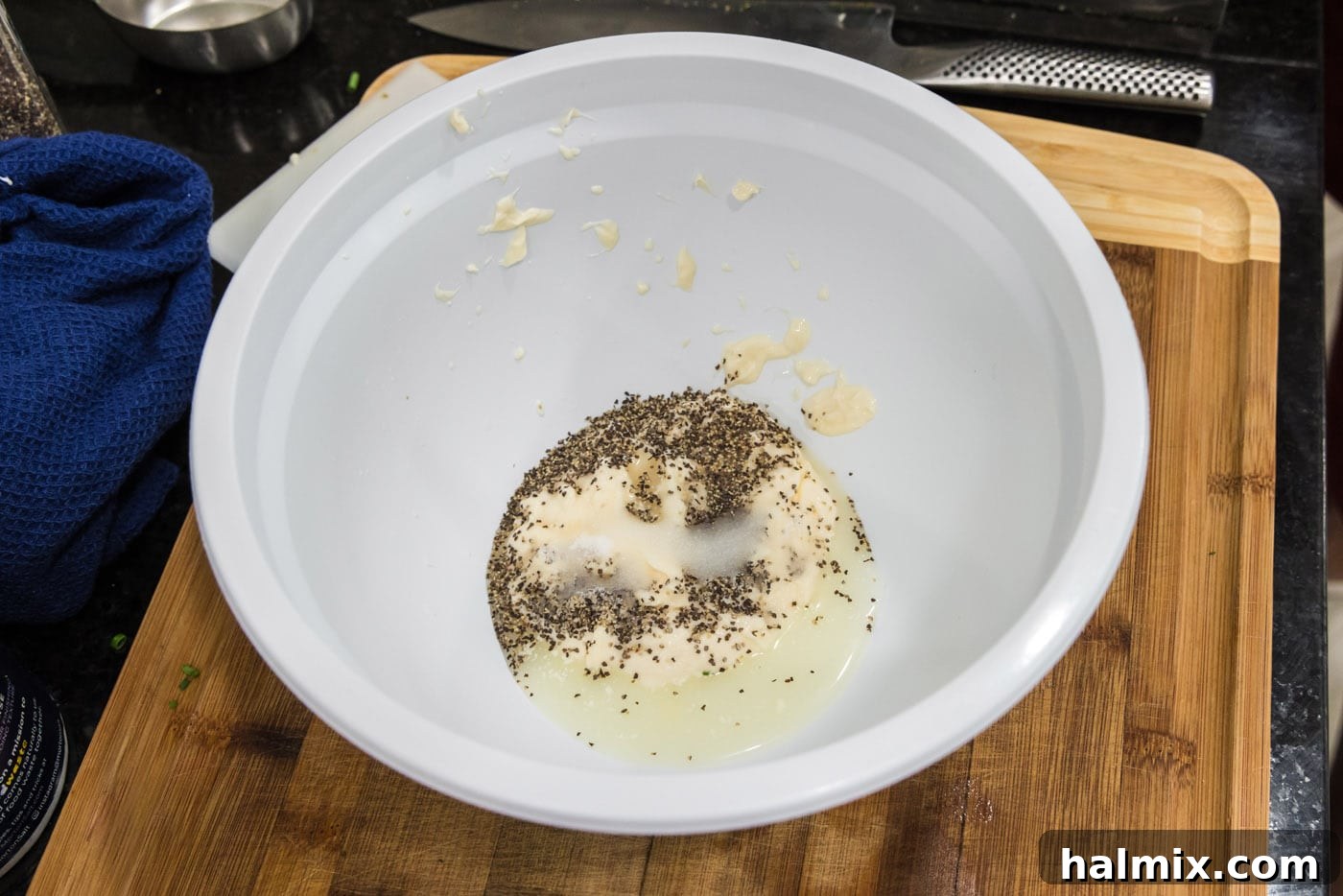 All creamy dressing ingredients for lobster salad placed in a mixing bowl before whisking.