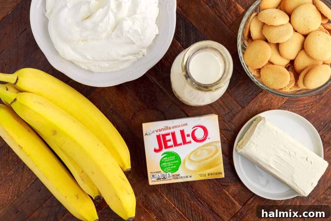 Various ingredients laid out for making Banana Trifle: cream cheese, milk, pudding mix, bananas, Nilla wafers.