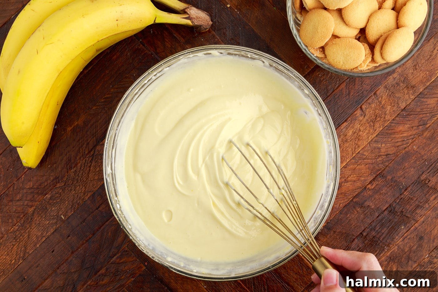 The thickened vanilla pudding and cream cheese mixture in a bowl after whisking.