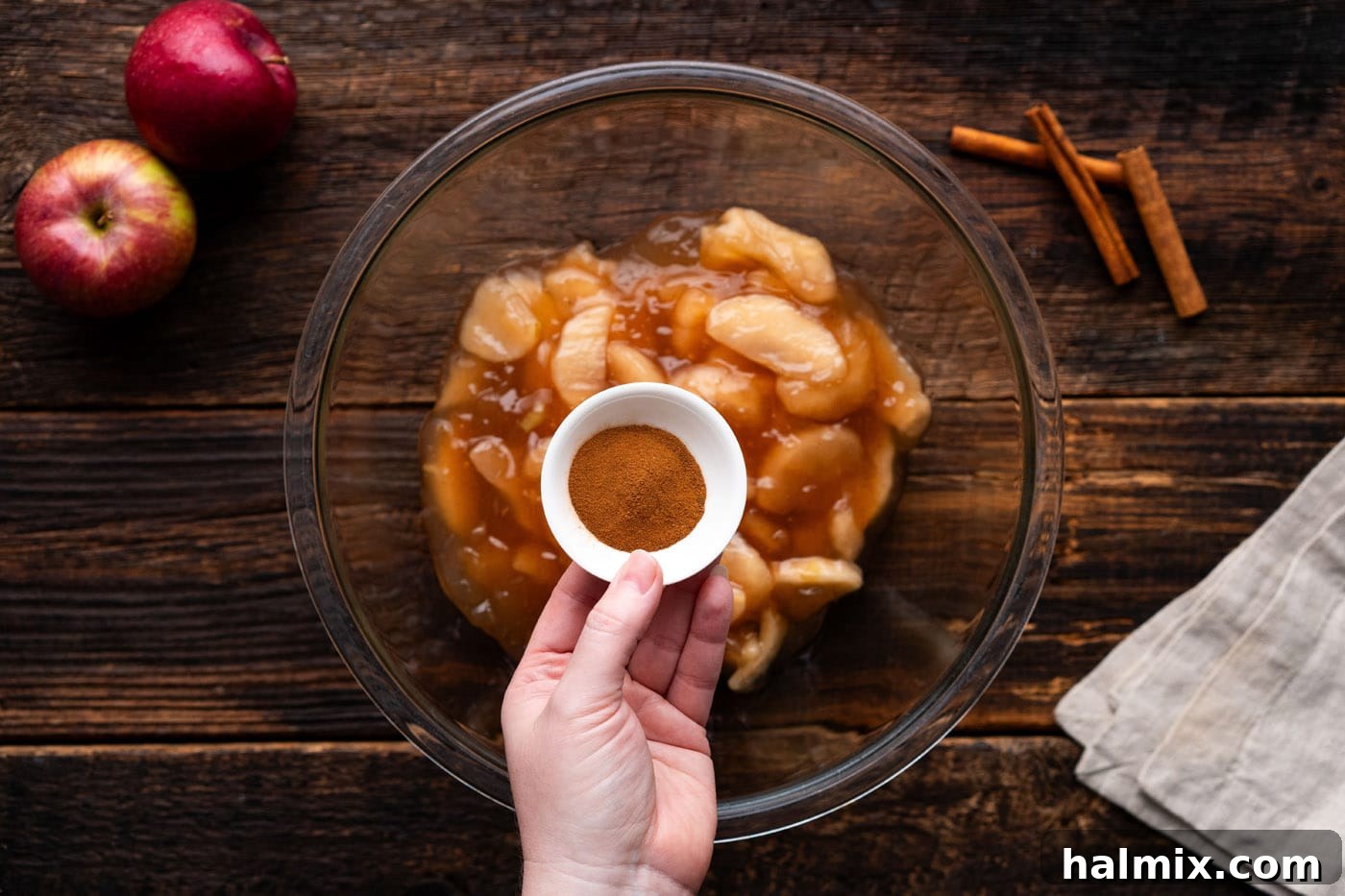 No-Fuss Caramel Apple Delight 5 adding cinnamon to apple pie filling