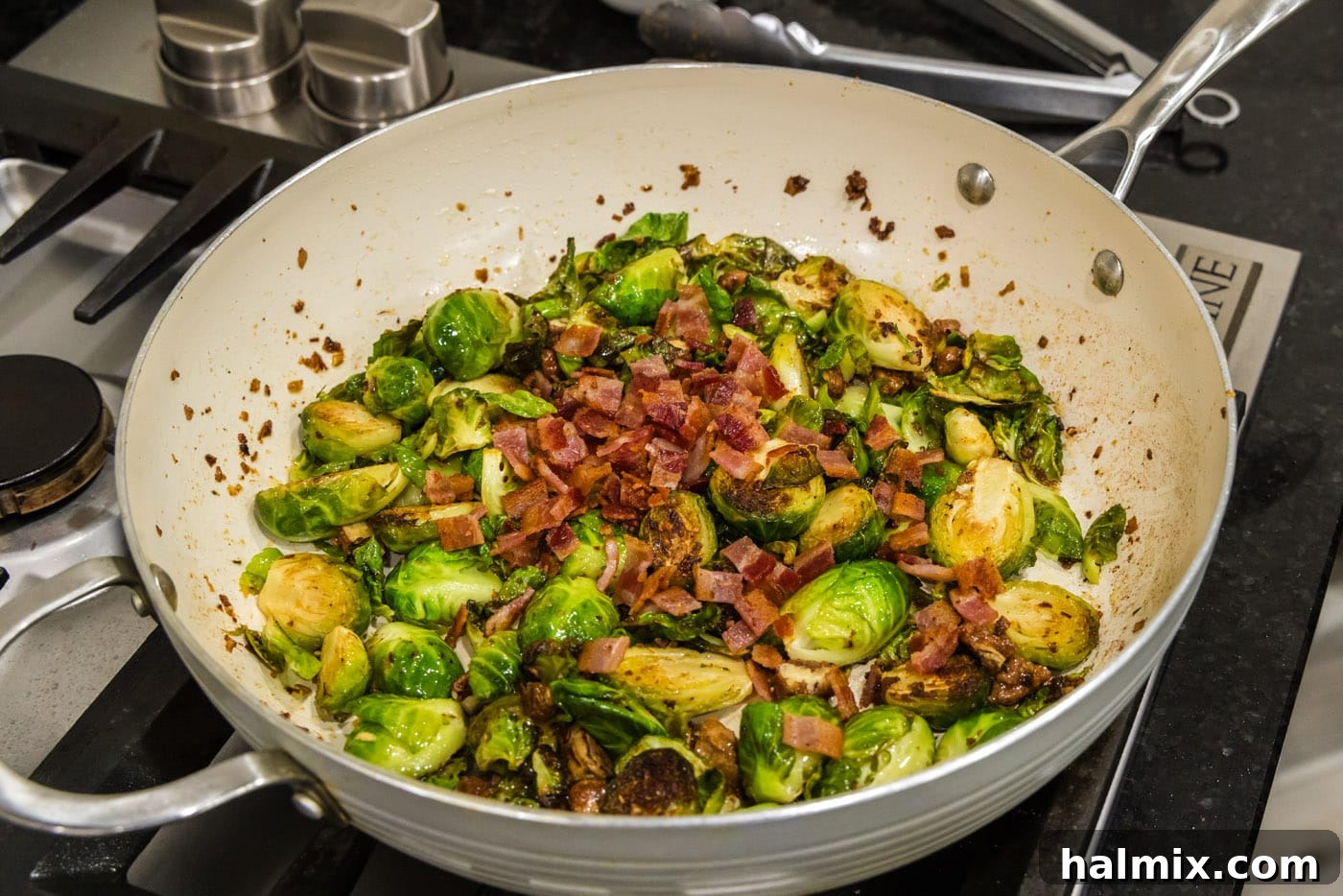 chopped bacon added to brussels sprouts with candied pecans, combining flavors