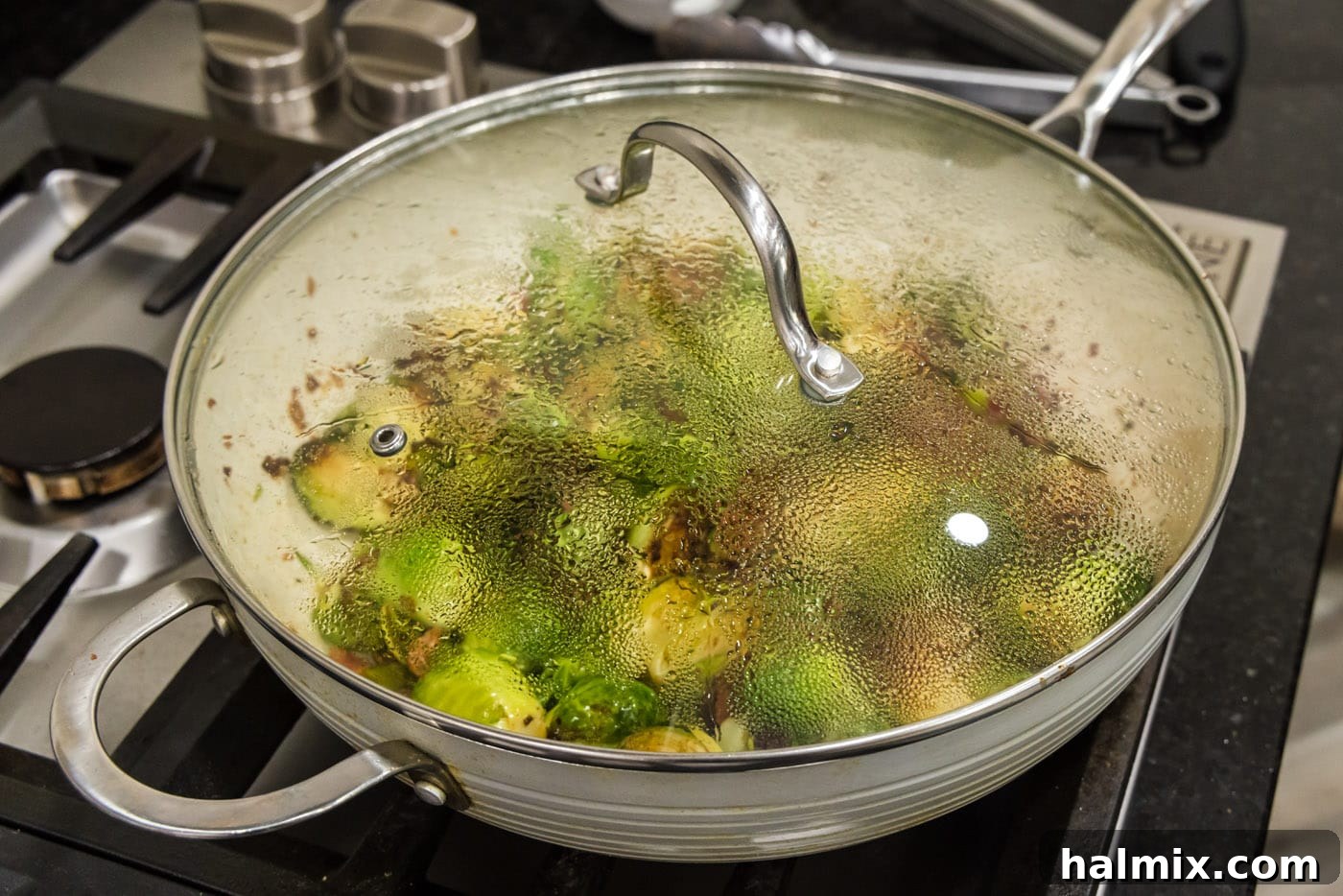 cooking brussels sprouts with bacon, shallots, and candied pecans, showcasing the finished dish