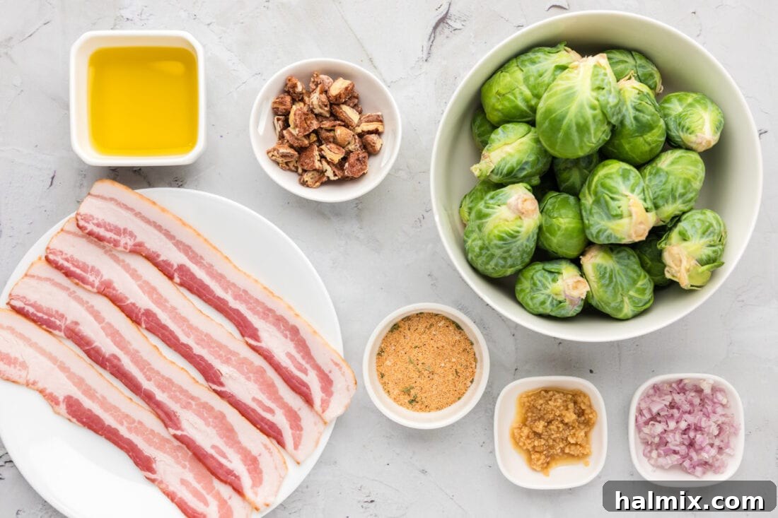 Collection of fresh ingredients for Brussels Sprouts with Bacon, Shallots and Candied Pecans, including sprouts, bacon, shallots, and pecans
