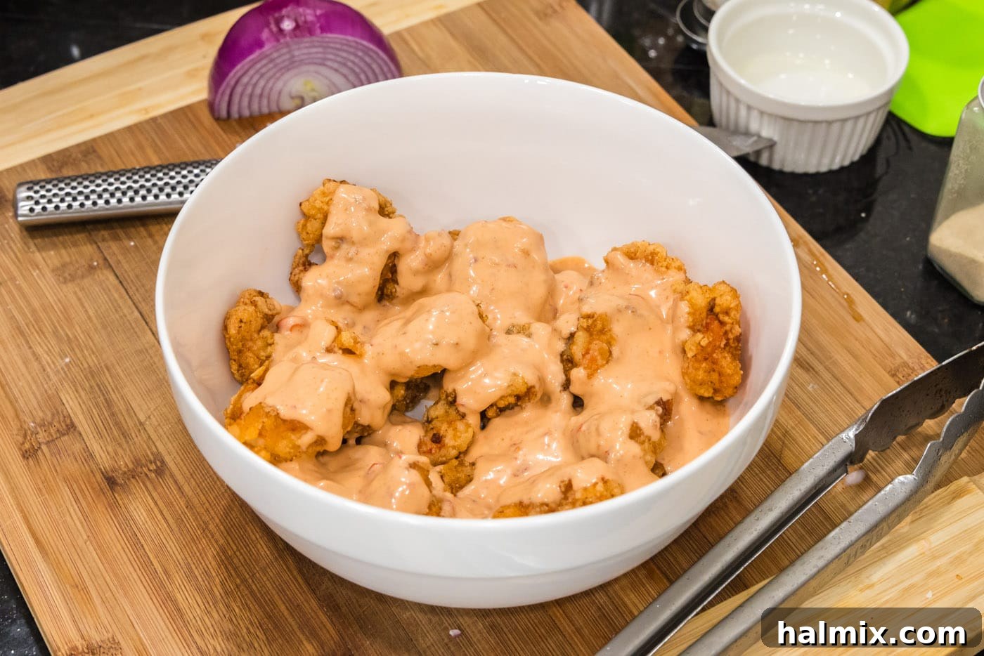 Electric Shrimp Bites 12 bang bang sauce over fried shrimp