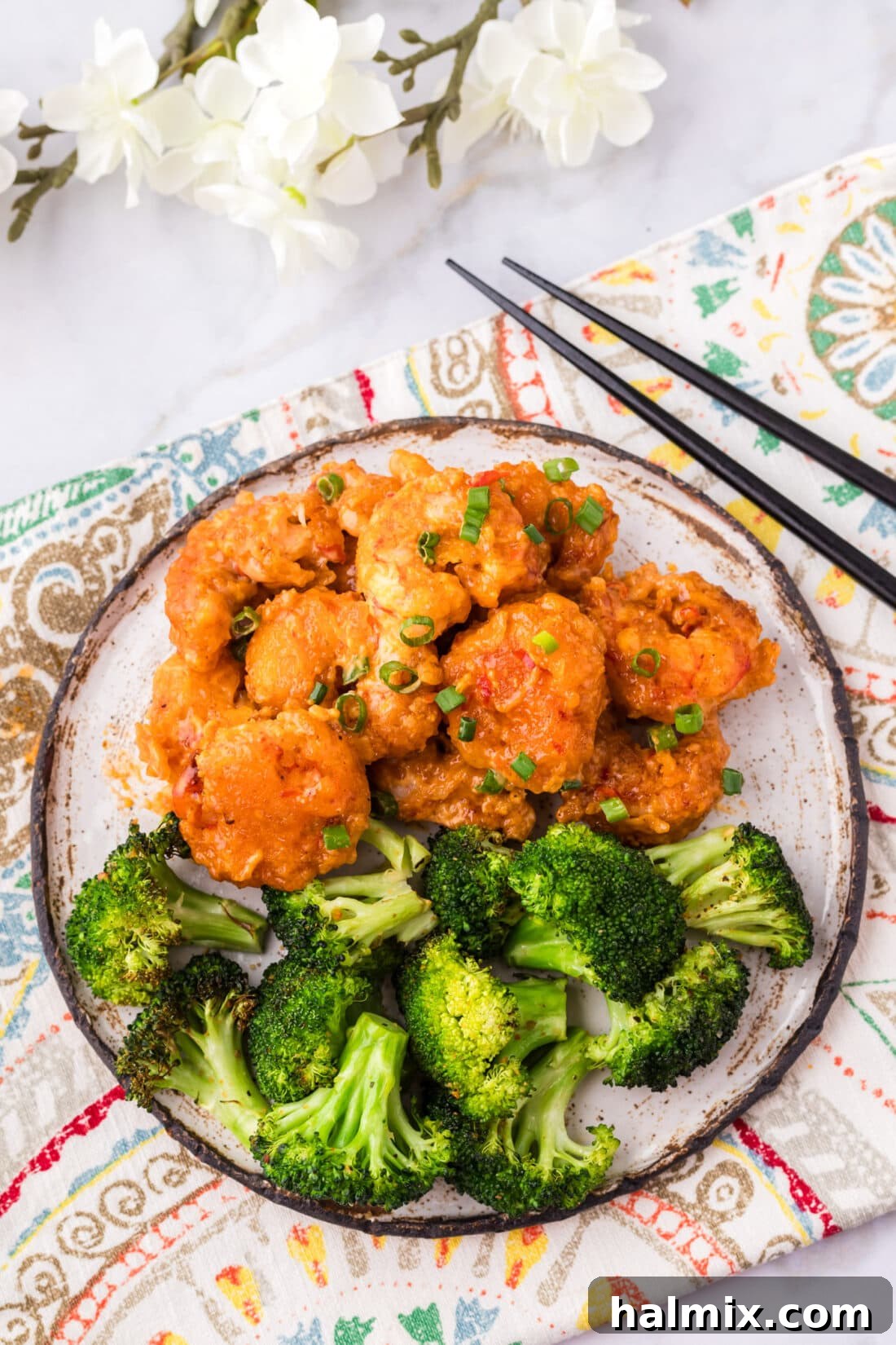 Electric Shrimp Bites 3 Bang Bang Shrimp on a plate with broccoli