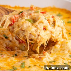 Hearty King Ranch Chicken Bake 17 Close up photo of a spatula of King Ranch Chicken Casserole, showing the layers.