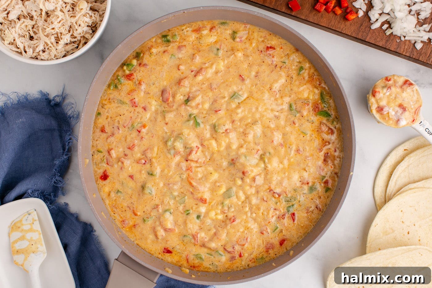 Hearty King Ranch Chicken Bake 8 The creamy King Ranch casserole sauce simmering in a skillet.