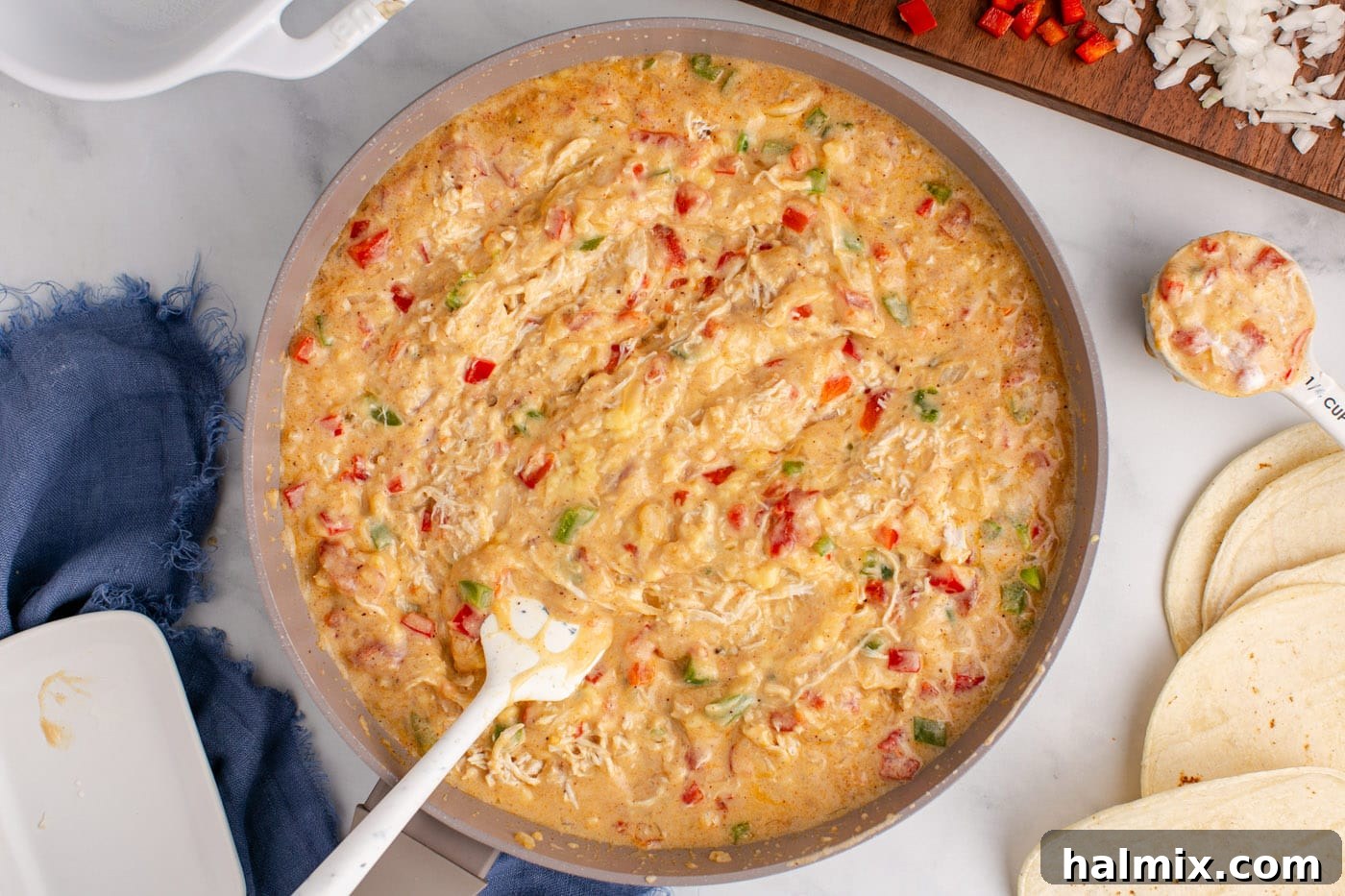 Hearty King Ranch Chicken Bake 10 All the King Ranch casserole ingredients, including chicken and sauce, mixed together in a skillet.