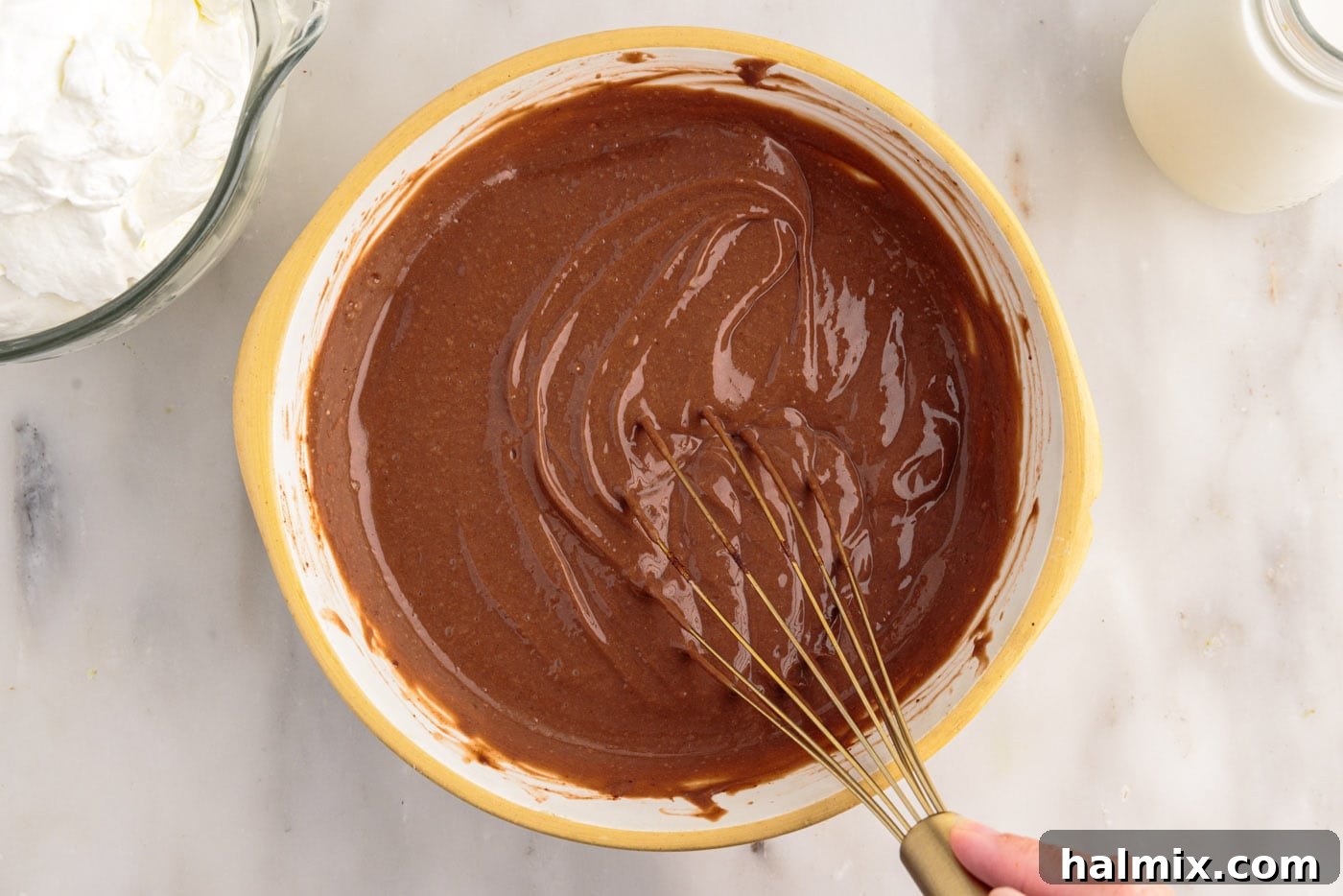 Ultimate Fudge Brownie Trifle 7 Whisking instant chocolate pudding mix with milk until it begins to thicken