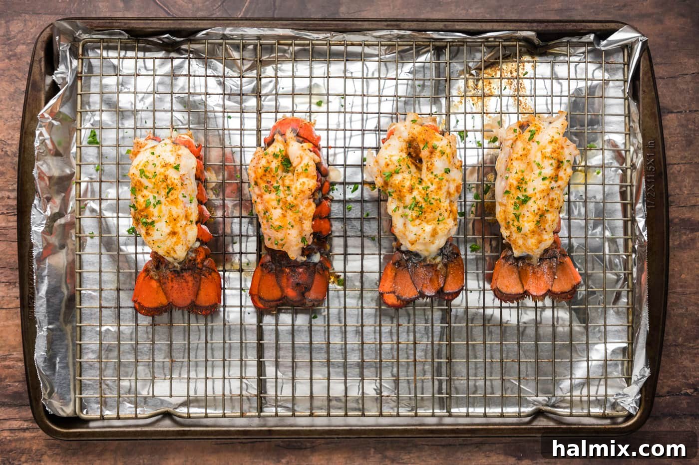 baked lobster tails on a wire rack