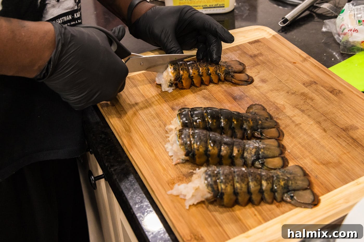 using kitchen shears to slice through lobster shell