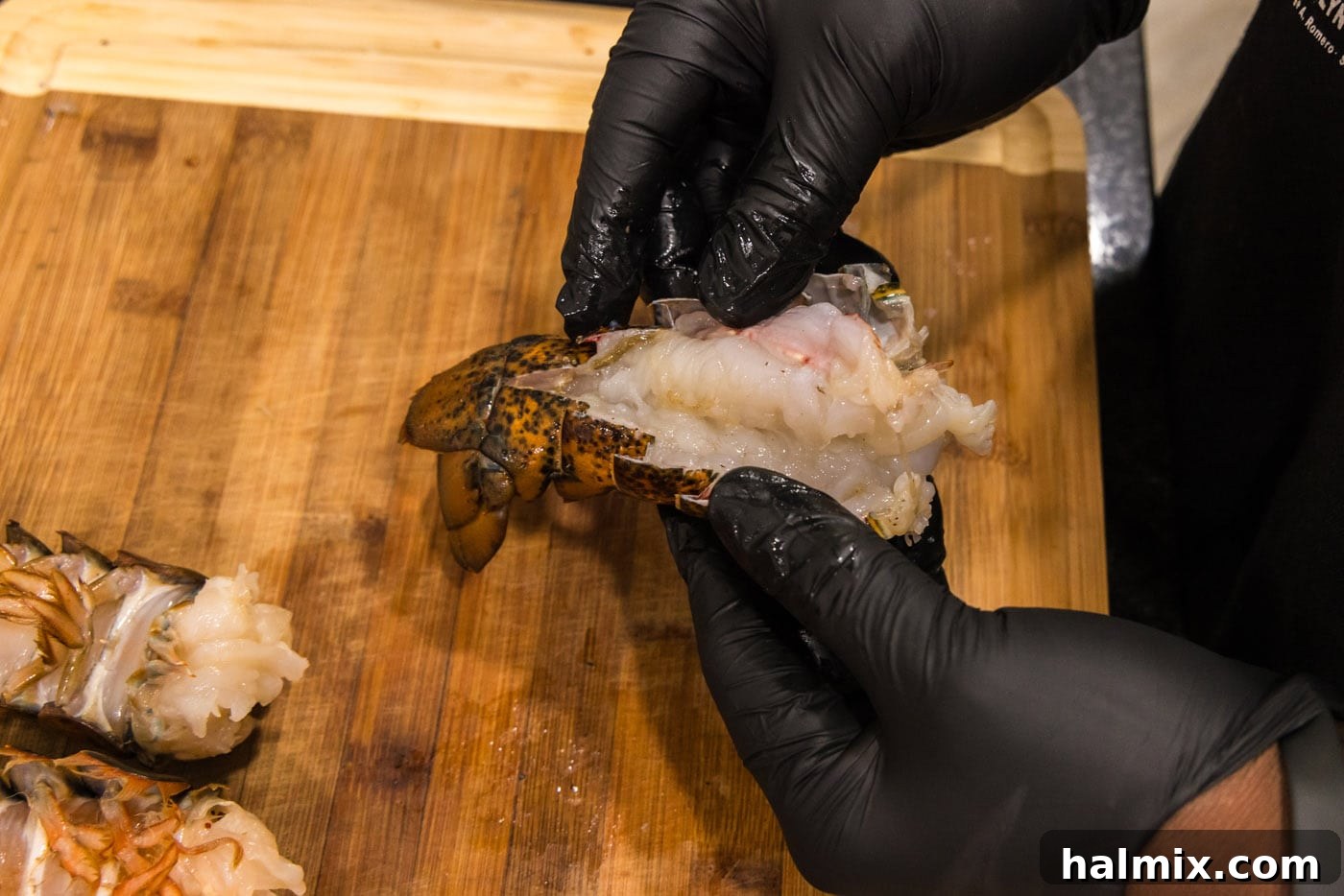 exposing meat from lobster shell
