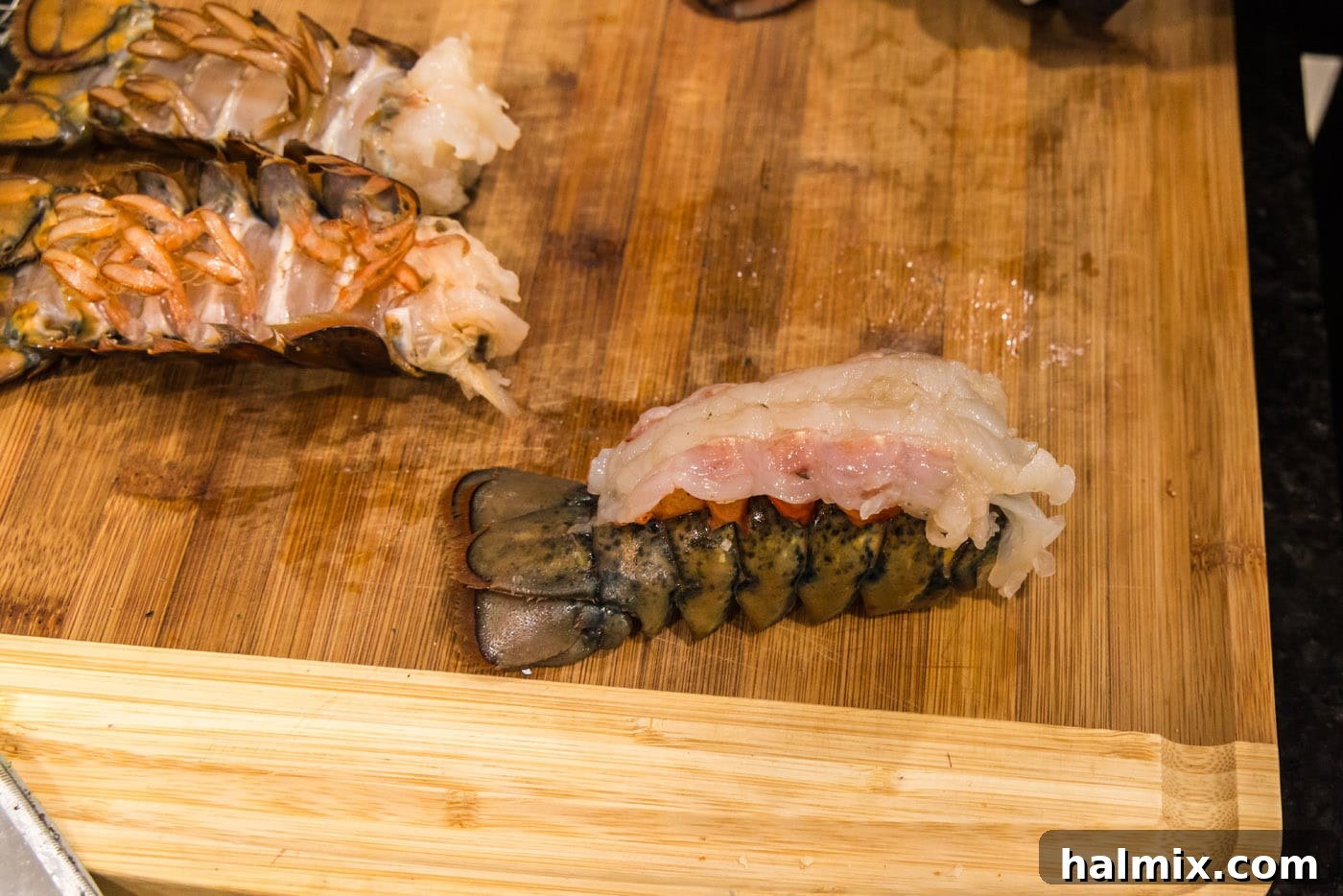 crowned lobster on a cutting board