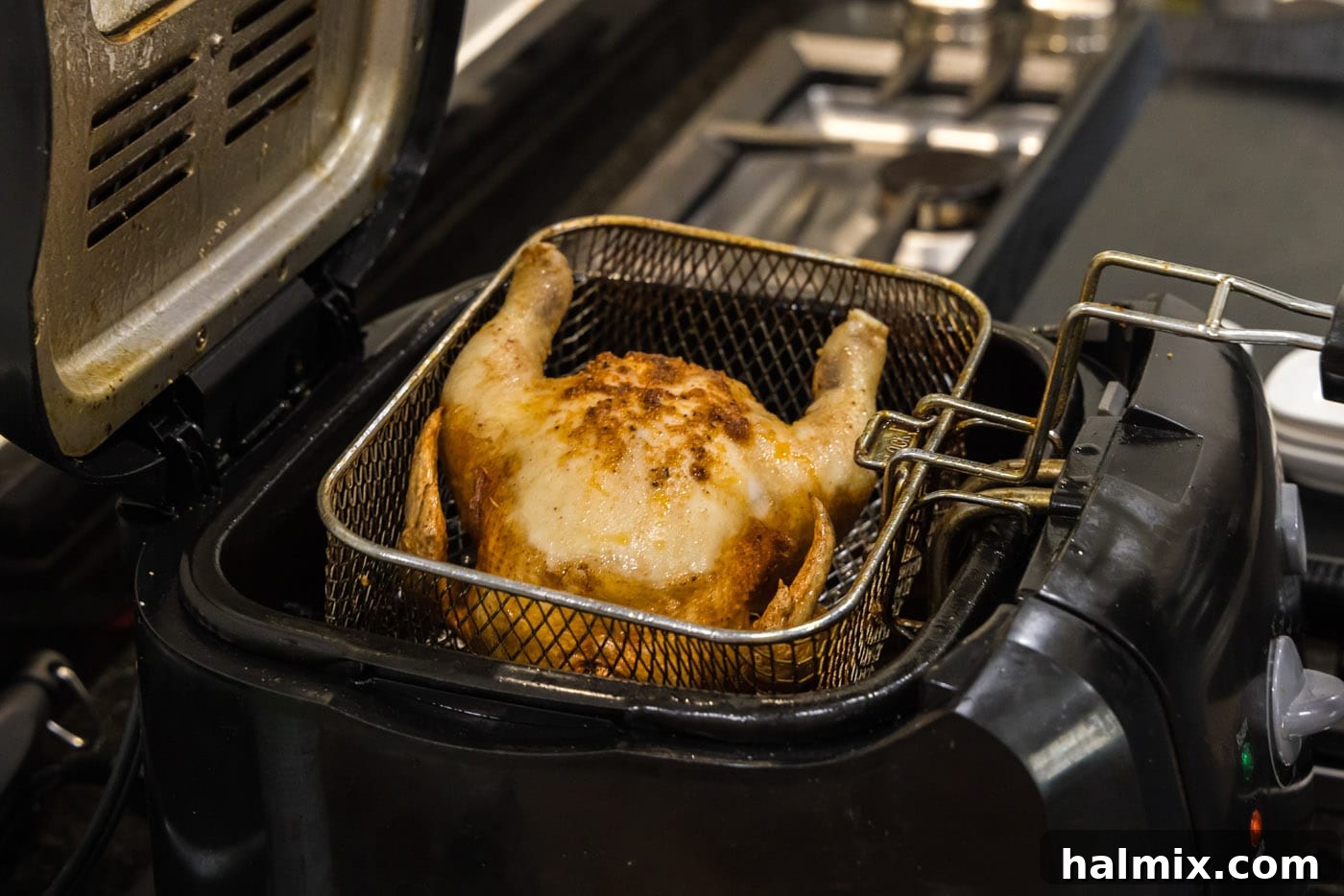 lifting cornish hen from deep fryer basket