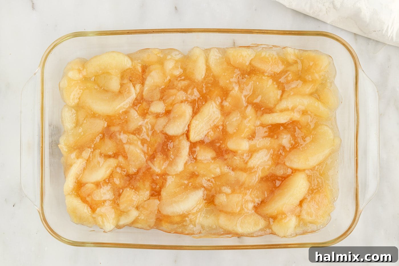 apple pie filling in a glass baking dish