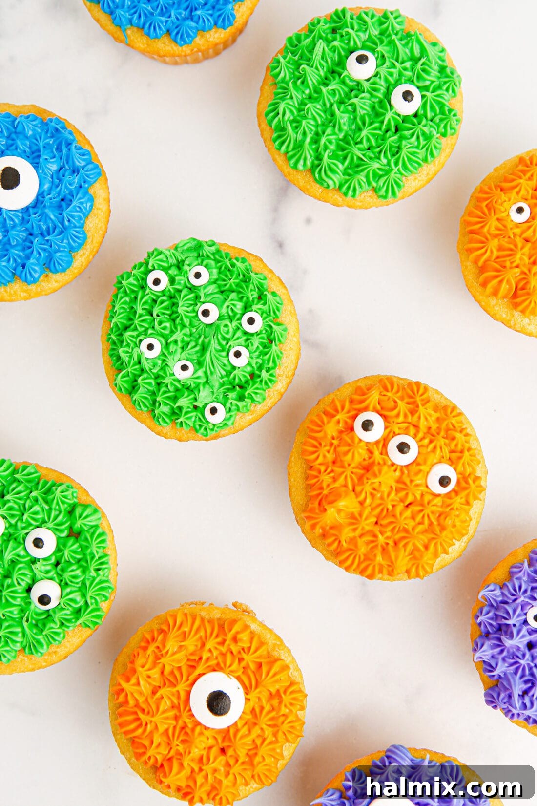 Overhead photo of colorful Monster Cupcakes arranged