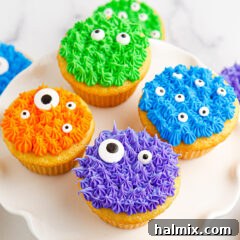 Close up photo of Monster Cupcakes on a cake stand