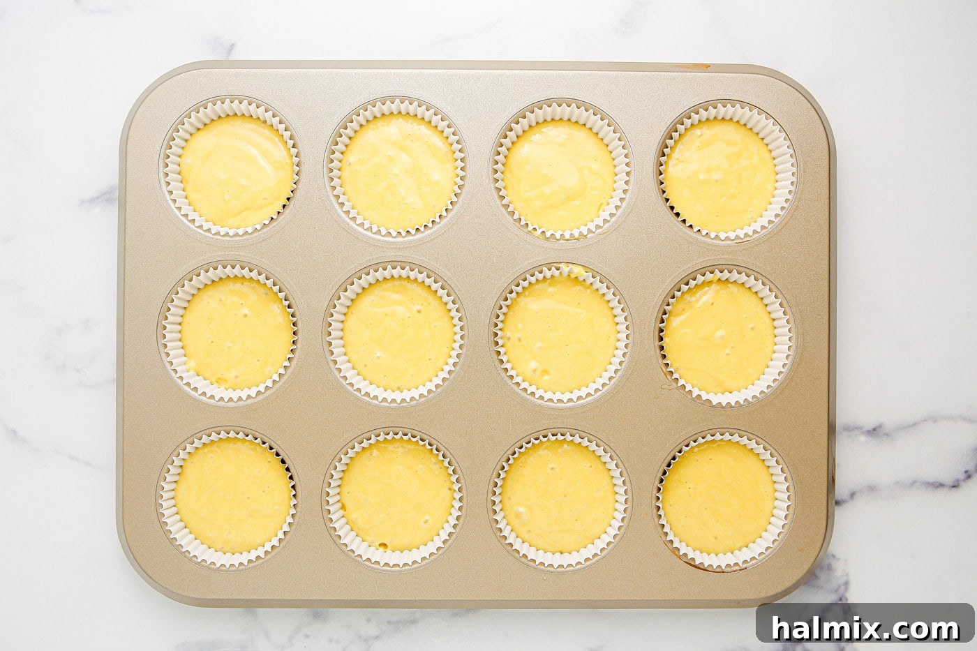Freshly baked cupcakes on a wire rack