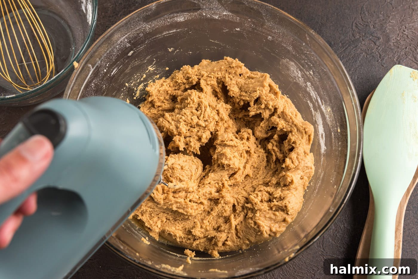 mixing peanut butter cookie dough with an electric mixer