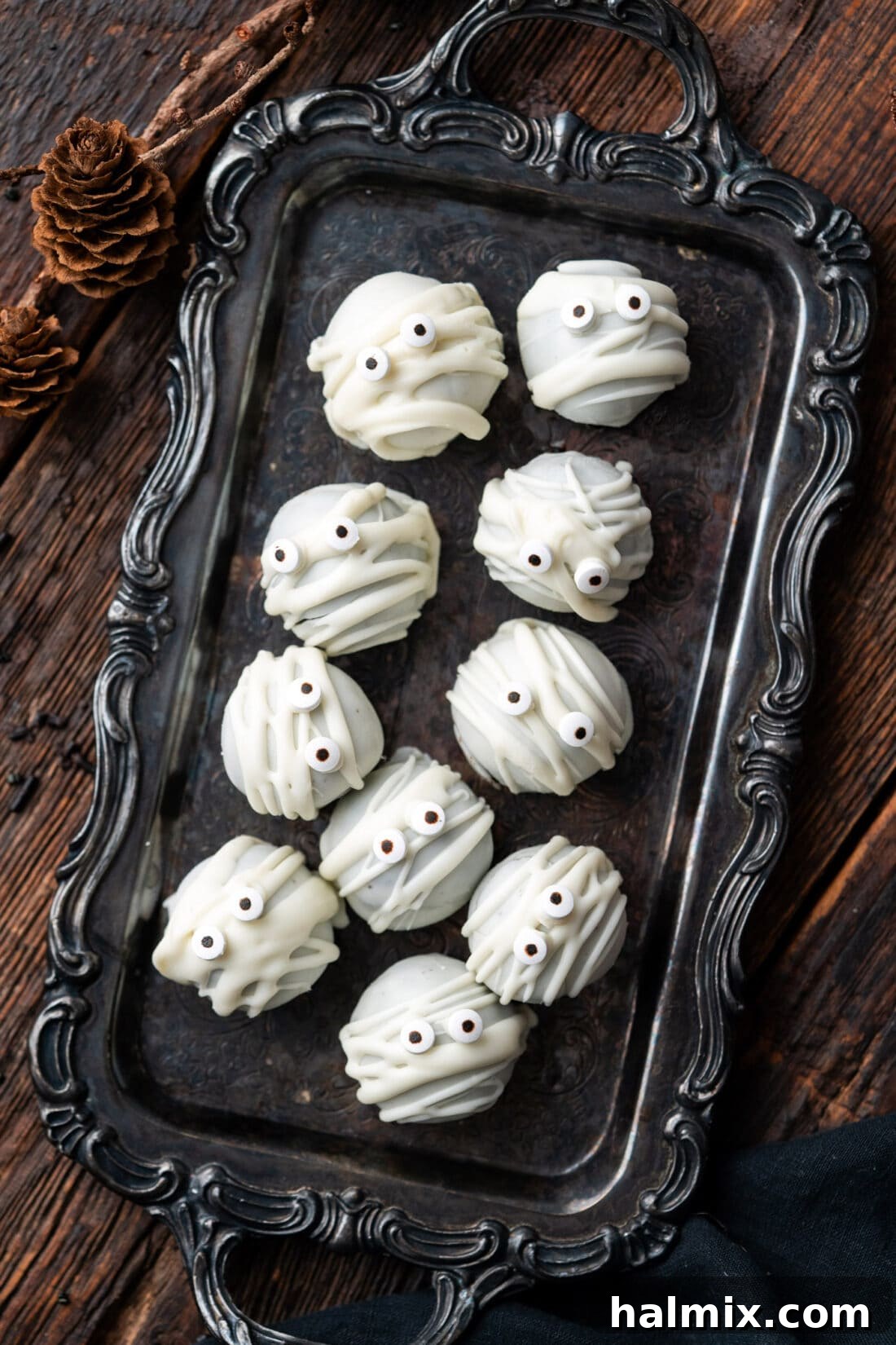 Hauntingly Delicious Oreo Truffles 2 Mummy Oreo Truffles on a black tray