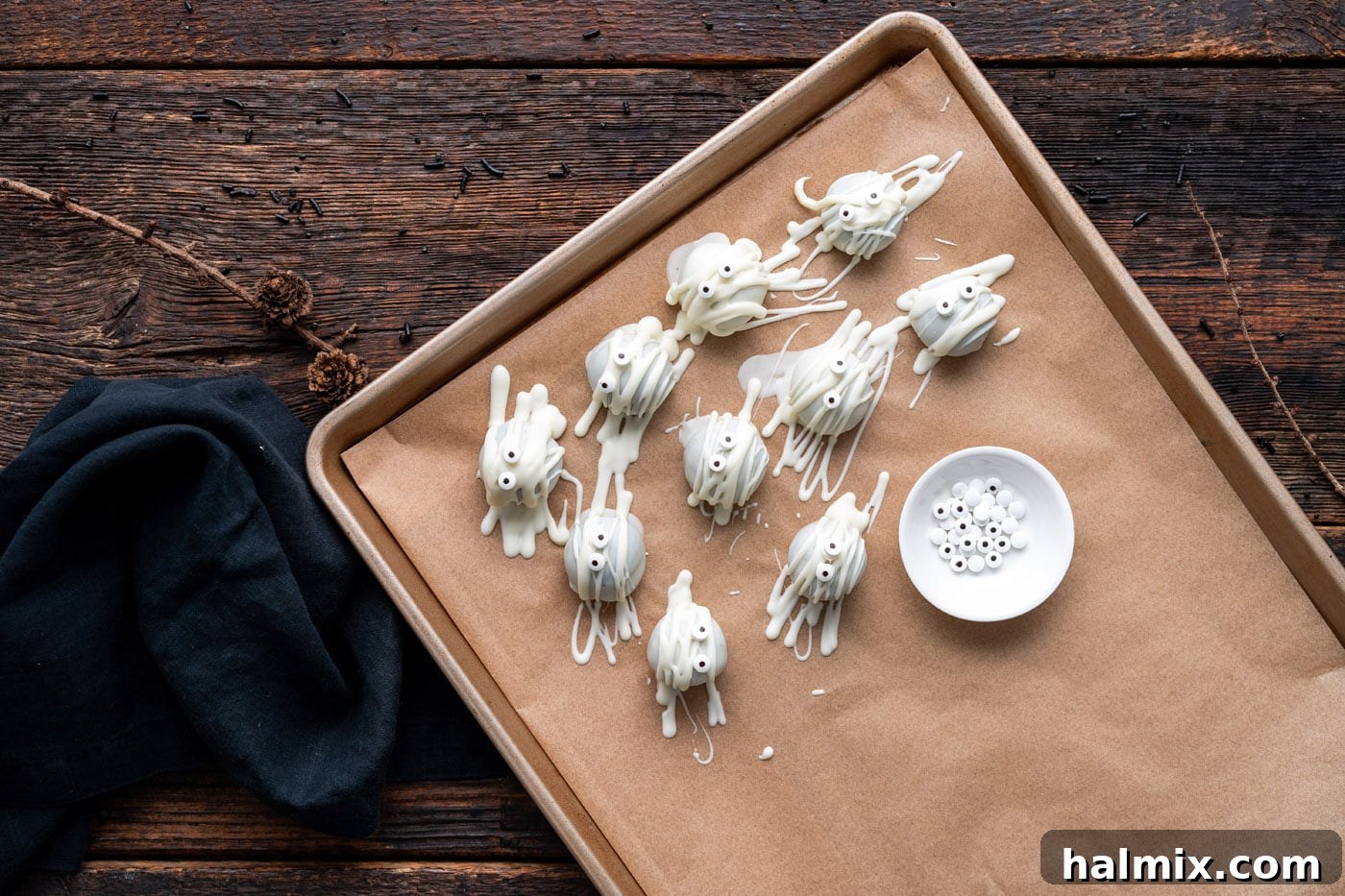 Hauntingly Delicious Oreo Truffles 12 mummy oreo truffles on a baking sheet