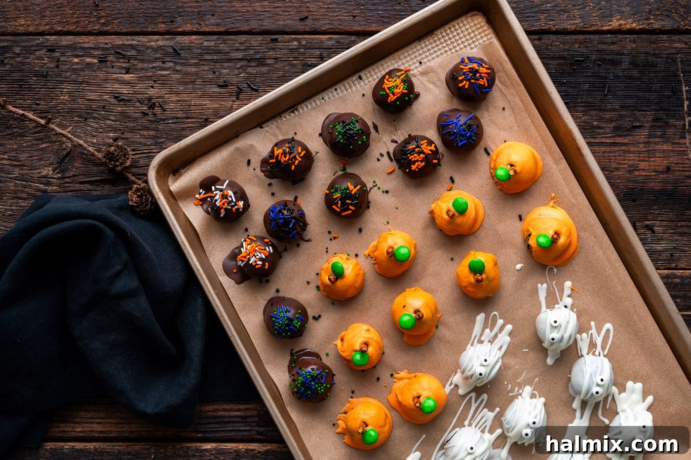 Hauntingly Delicious Oreo Truffles 16 Halloween oreo truffles on a baking sheet