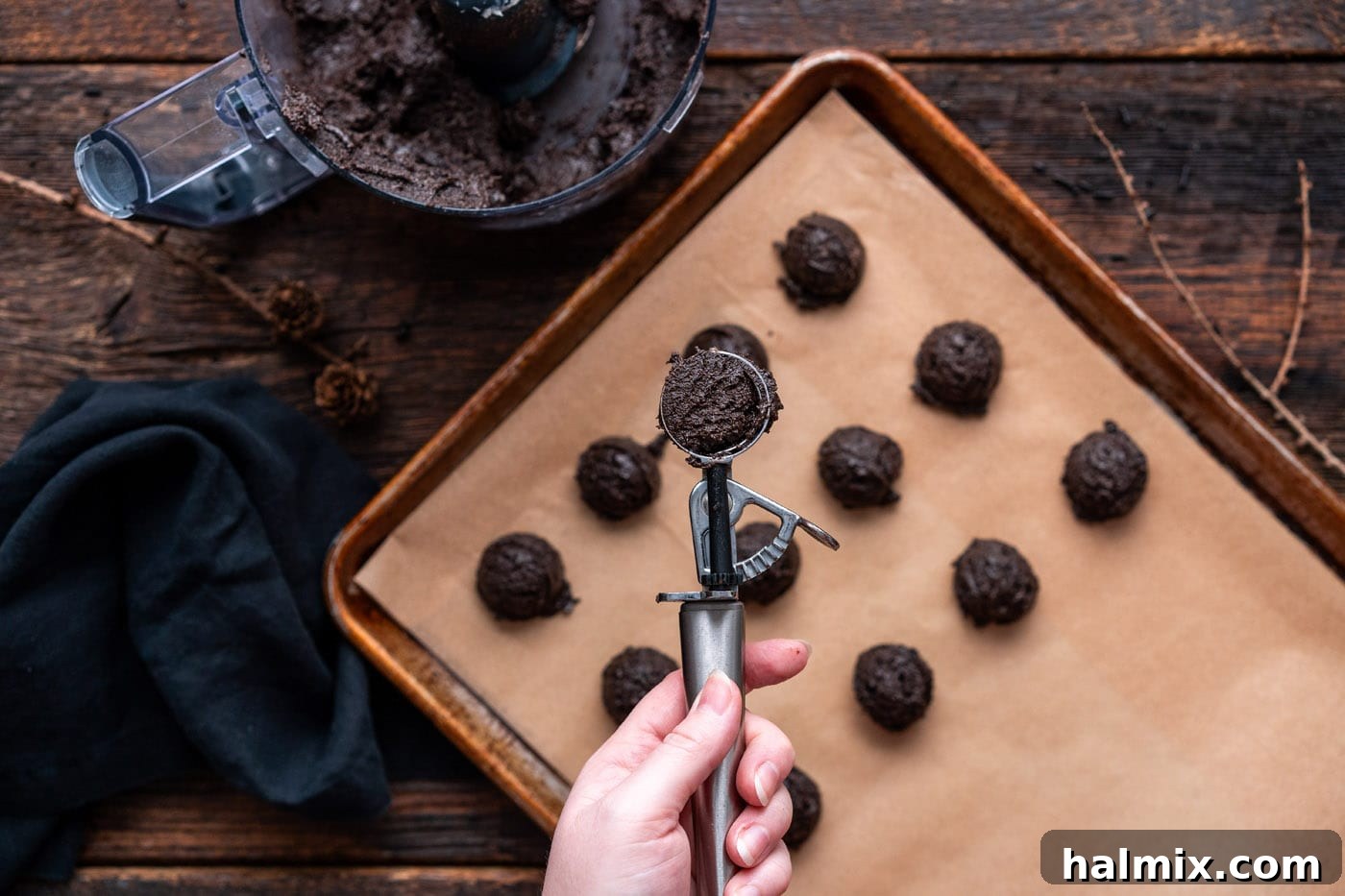 Hauntingly Delicious Oreo Truffles 8 scoop of oreo truffles over a baking sheet