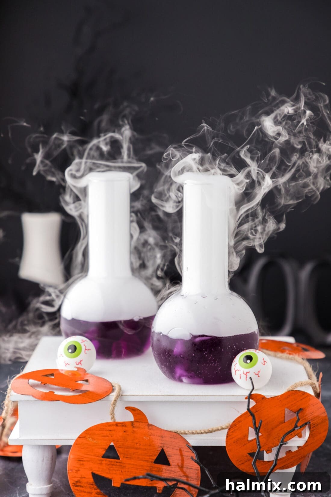 Purple Predator Potion 5 Two Purple People Eater Cocktails on a tray with dry ice fog