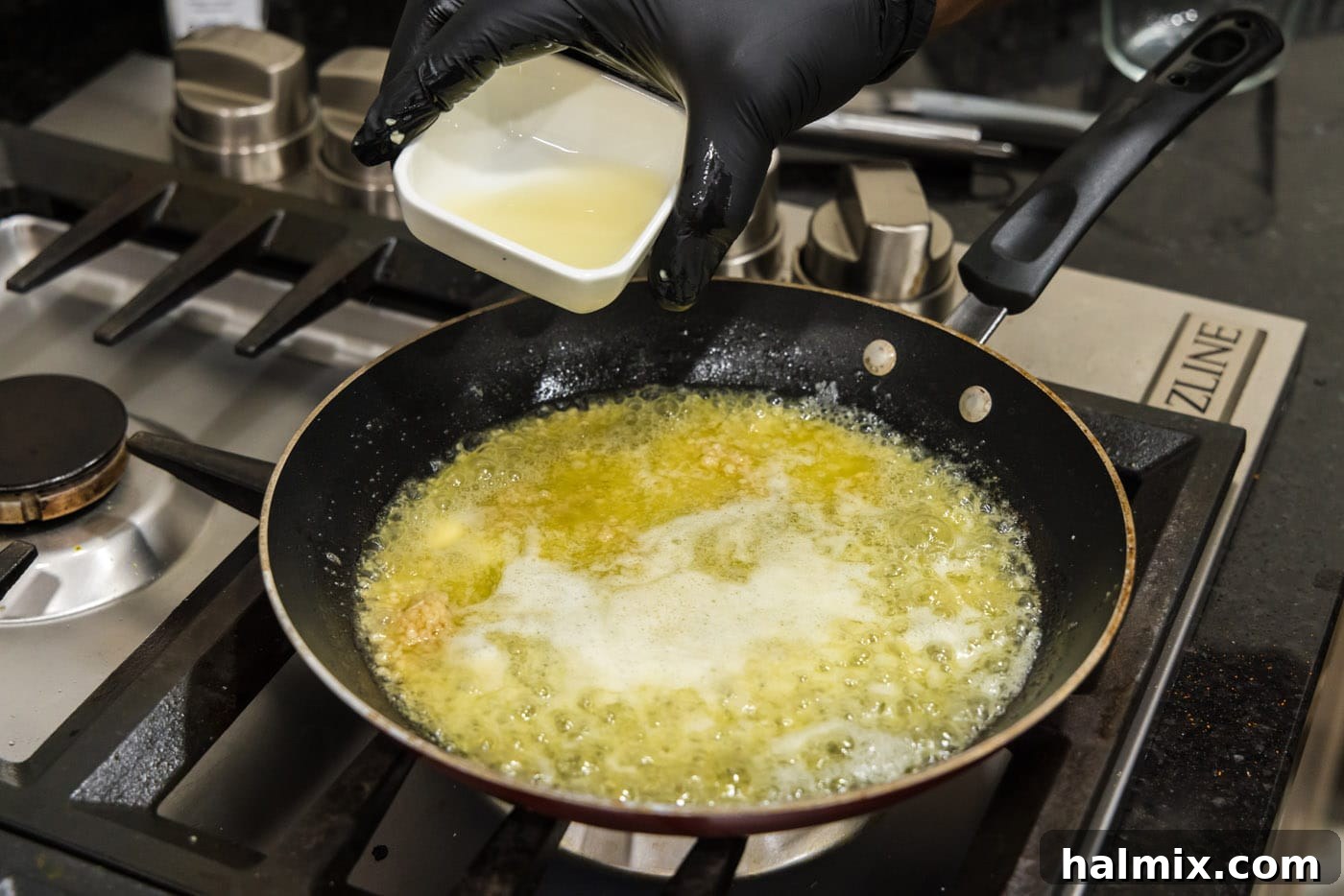 Irresistible Garlic Butter Sauce 7 Pouring fresh lemon juice into the hot melted butter and garlic mixture in a skillet, creating a vibrant aroma.