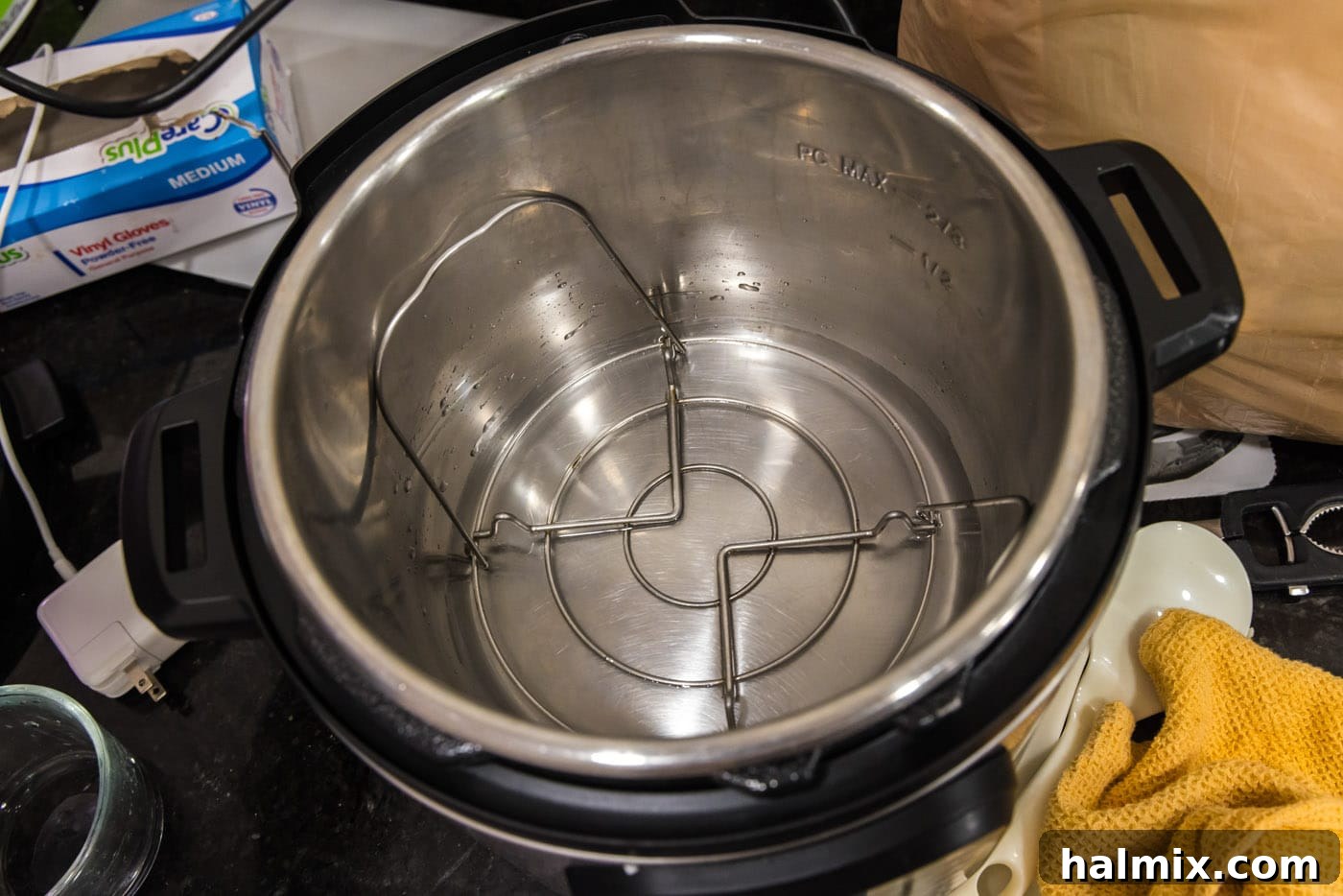 Effortless Instant Pot Cauliflower 7 The trivet (steaming rack) positioned inside the Instant Pot's inner pot, with the specified amount of water added below it.