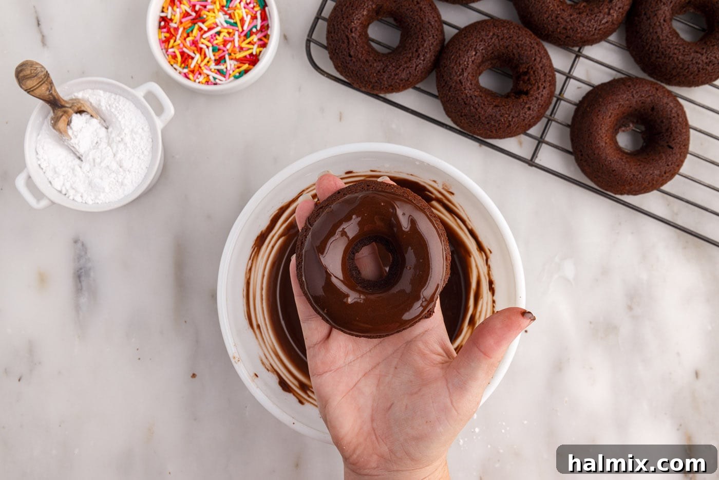 A freshly glazed chocolate bronut ready to be served